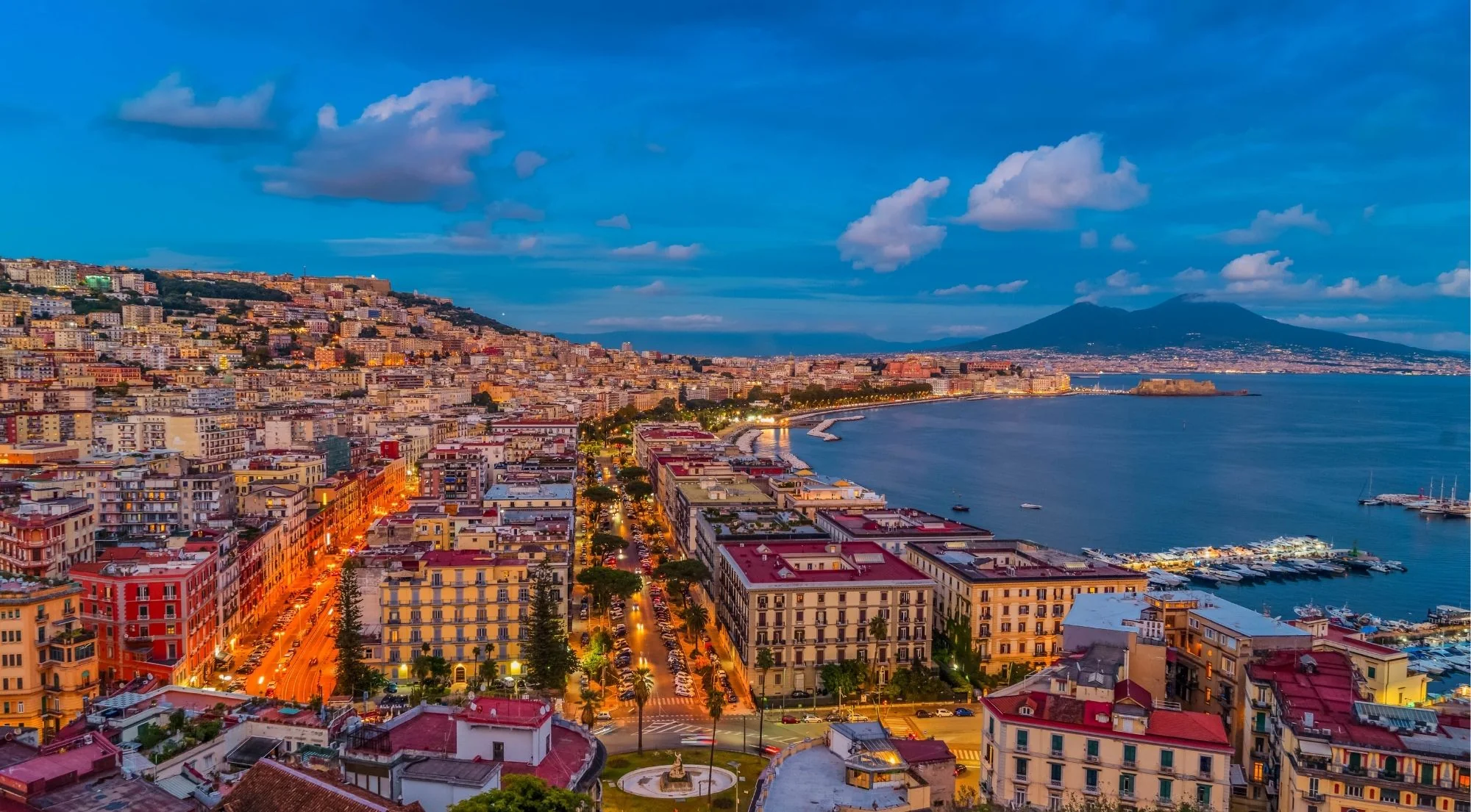 Panoramic twilight view of Naples with Vesuvius and the Bay of Naples from the hilltops